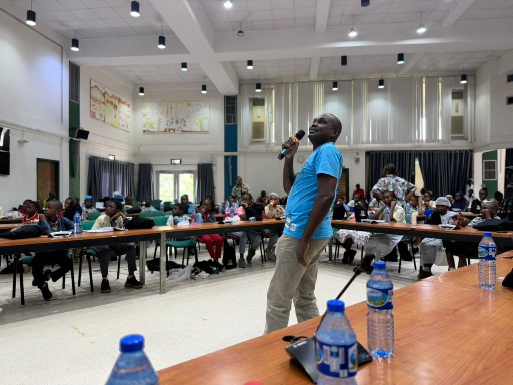 Dr Mark talks to students during climate hero children's day event | Wild Africa